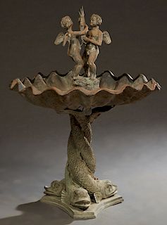Patinated Bronze Fountain, 20th c., with two winged putti holding a swordfish, in the center of a large circular shell, on a tripodal entwined dolphin
