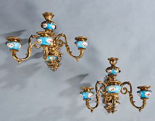 Pair of Bronze and Porcelain Sevres Style Four Light Sconces, early 20th c., the relief floral and leaf decorated back plate issuing a central floral 