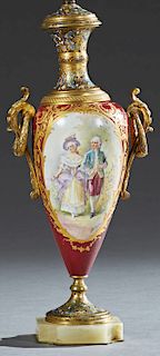 French Sevres Style Ormolu Mounted Porcelain and Champleve Lamp, early 20th c., with a champleve neck over a baluster body with ring handles and a cen