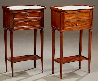 Pair of French Carved Mahogany Louis XVI Style Marble Top Nightstands, early 20th c., the 3/4 galleried tops with an inset figured white marble over t