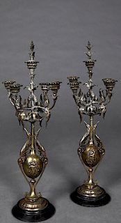 Pair of French Brass and Marble Five Light Candelabra, late 19th c., the five leaf decorated candle arms issuing from an egg shaped support with relie