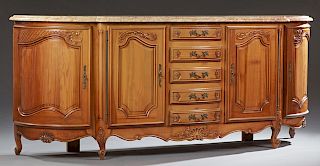 Louis XV Style Carved Cherry Marble Top Sideboard, 20th c., the breakfront demilune highly figured rouge and ochre marble over a central bank of five 
