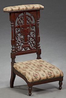 French Carved Walnut Prie Dieu, 18th c., the rectangular armrest over a pierced cross splat flanked by turned tapered supports above a trapezoidal sea
