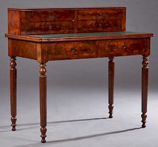 French Louis Philippe Style Carved Mahogany Writing Table, c. 1860, with four drawers over a slide out gilt tooled green leather writing surface above