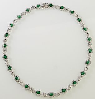 Platinum Link Necklace, with 23 oval links with oval diamonds atop diamond mounted borders, joined by 22 pierced diamond mounted floret links, total e