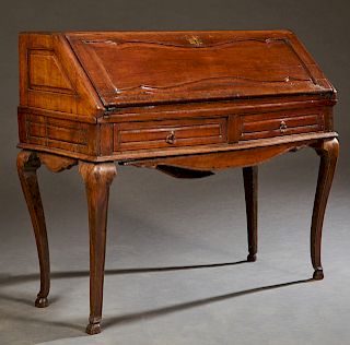French Louis XV Style Carved Walnut Slant Front Secretary, 19th c., the rectangular top over a fielded panel slant lid enclosing an interior fitted wi