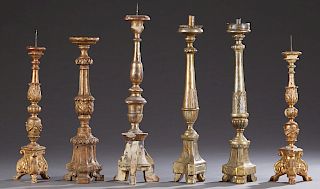 Group of Six Gilt Tripodal Pricket Candlesticks, consisting of a near pair of knopped examples on paw feet; a pair of silver gilt examples on triangul