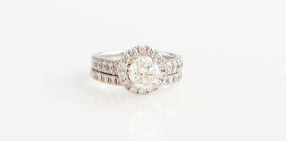 14K White Gold Engagement Ring, with a round 1.23 carat diamond, atop a border of small round diamonds, the shoulders mounted with graduated round dia