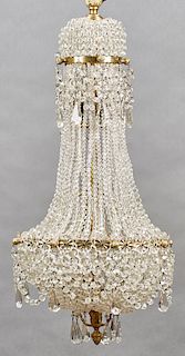Exceptional French Empire Style Gilt Bronze and Crystal Five Light Corbeille Chandelier, 20th c., the top issuing short beaded crystal chains with a p