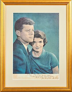 John and Jacqueline Kennedy Colored Photograph, c. 1960, with a pen autograph of Jacqueline lower left margin, and a pen inscription lower right margi