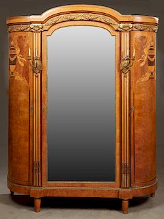 French Five Piece Ormolu Mounted Inlaid Mahogany and Elm Bedroom Suite, c. 1890, consisting of a large arched crown armoire with a central wide bevele