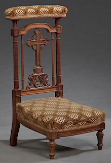 French Louis XVI carved Walnut Style Prie Dieu, 19th c., the upholstered armrest on turned reeded supports enclosing a cross backsplat, to a bowed bas