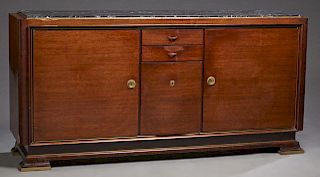 French Art Deco Carved Mahogany Ormolu Mounted Marble Top Sideboard, c. 1940, the inset highly figured black marble over a central bank of two drawers