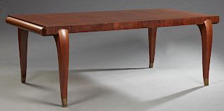 French Art Deco Carved Kingwood Dining Table, c. 1930, the rectangular top over a skirt with two rounded pullout leaf holders, on rounded square cabri