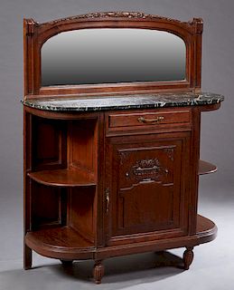 French Carved Oak Henri II Style Marble Top Sever, c. 1880, the arched crown over a wide beveled mirror splash, above a highly figured rounded corner 