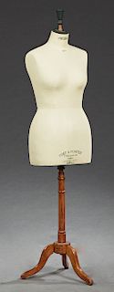 French Cloth Covered Female Mannequin, 19th c., the form stamped "Pret a Porten Stockman, Paris," and "Fabrication Siegel, Paris," on a turned walnut 