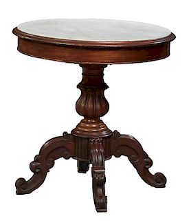 French Louis Philippe Carved Walnut Marble Top Center Table, 19th c., the inset figured white circular marble over a reeded baluster urn support, on f