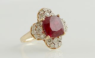 Lady's 14K Rose Gold Dinner Ring, with a cushion cut 6.68 carat ruby atop a stylized floret mounted with round diamonds, total diamond weight- .99 cts