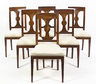 A Set of Six Continental Walnut Dining Chairs, Height 36 3/4 inches.