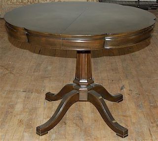 An American Mahogany Center Table, Height 30 x width 38 x depth 38 inches (closed).