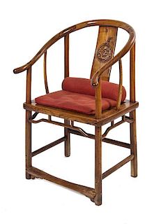 A Chinese Carved Wood Horseshoe Back Armchair, Quanyi, Height 37 inches.