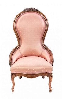 A Victorian Walnut Slipper Chair, Height 41 inches.