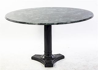 An American Dining Table, Height 28 x diameter 48 1/2 inches.