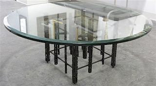 A Modernist Welded Steel and Glass Low Table, Height 16 1/4 x diameter 42 inches.