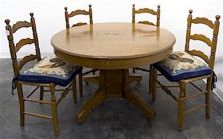 An American Oak Extension Dining Table, Height of first 28 1/2 x diameter 47 inches.