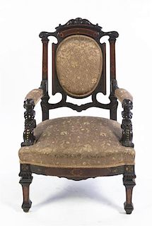 A Victorian Burlwood and Parcel Ebonized Armchair, Height 40 1/2 inches.