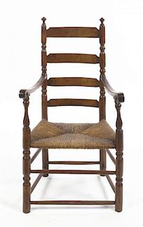 An American Ladder Back Armchair, Height 41 inches.