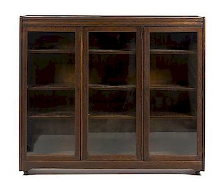 An Arts & Crafts Oak Bookcase, Height 51 x width 59 x depth 12 inches.