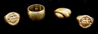 Four 14 Karat Gold Rings