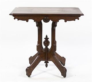 An Eastlake Style Mahogany Center Table, Height 28 1/4 inches.