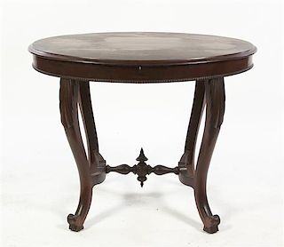 A Victorian Mahogany Occasional Table, Height 27 1/2 inches.