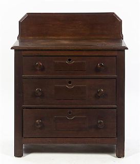 A Victorian Walnut Small Chest of Drawers, Height 35 1/4 inches.