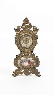 A French Gilt Metal and Porcelain Inset Desk Clock, Height 9 inches.