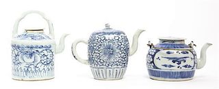 Three Blue and White Teapots, Height of tallest over handle 6 inches.