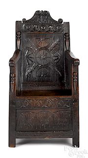 Charles II carved oak armchair