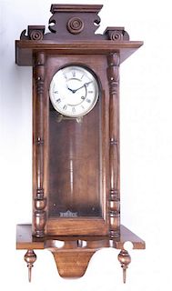An American Maple Regular Clock, Height overall 38 3/4 inches.