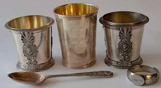 Silver lot to include three mugs including one marked John Slocum 1940, one spoon, and one napkin ring. 
18.9 troy ounces 
***If thi...