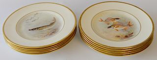 Set of ten Royal Doulton fish plates, hand painted center of fish with gold rim, signed C. Hart. 
diameter 9 1/2 inches 
***If this ...