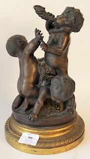 Bronze of three nude infants, one blowing into a cornucopia. 
total height 11 inches, width 7 1/2 inches 
***If this lot is not pick...