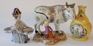 Three polychrome Dutch Delft pieces including a cow milking group having a figure holding a pail beneath a cow, 18th/19th century (b...