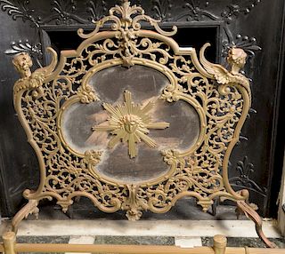 Louis XV style fire screen mounted with winged angels and set on claw feet. 
height 33 inches, width 31 inches 
***If this lot is no...