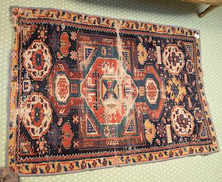Caucasian Oriental throw rug (cut borders, worn). 
***If this lot is not picked up on Sat. 9/22, Sun. 9/23, or Tues 9/25 at Bellevue...