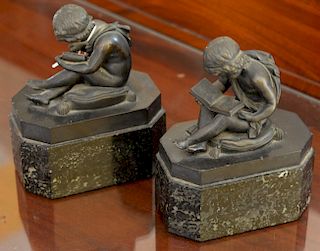 Pair of bookends with bronze boy reading on marble bases. 
height 7 inches 
***If this lot is not picked up on Sat. 9/22, Sun. 9/23,...