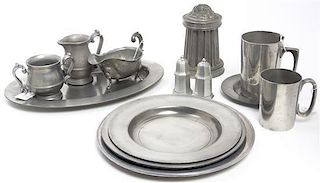 A Collection of Pewter Serving Articles and Dinnerware, 93 items total. Diameter of dinner plate 10 7/8 inches, each.