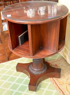 Round mahogany revolving book stand. 
height 28 1/4 inches, diameter 21 inches 
***If this lot is not picked up on Sat. 9/22, Sun. 9...