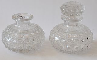 Pair of cut glass bottles having bulbous diamond cut body. height 4 1/2 inches and 6 1/2 inches ***If this l...